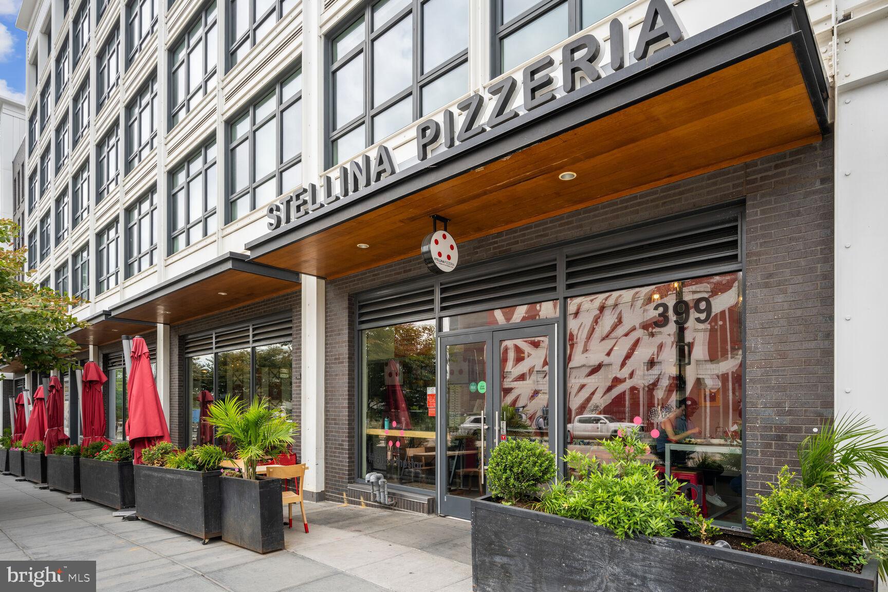 1143 5th Street Northeast, Unit 1 Washington, DC 20002 - Photo 50 of 54 a front view of building with an outdoor seating