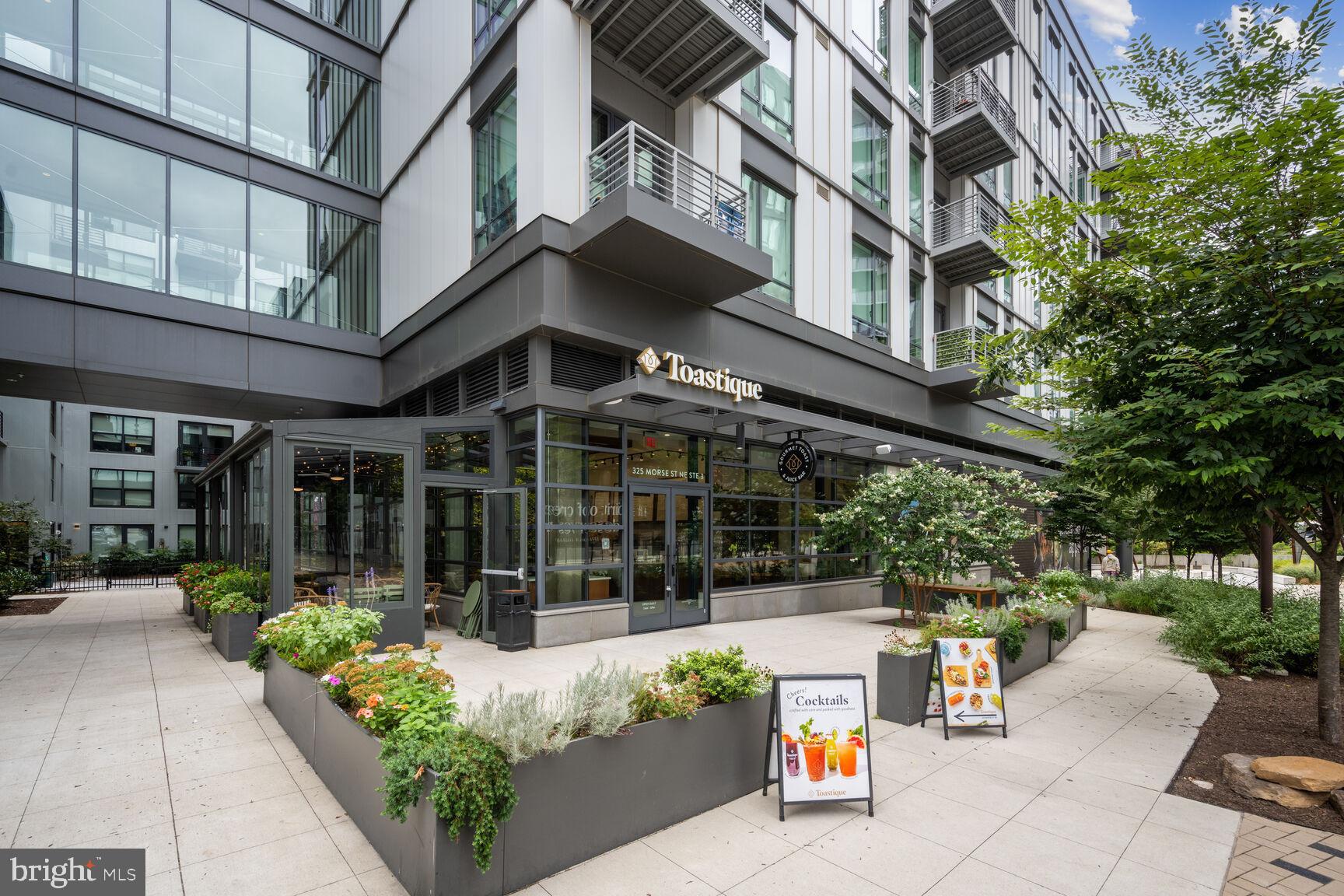 1143 5th Street Northeast, Unit 1 Washington, DC 20002 - Photo 53 of 54 a view of a building with sitting area