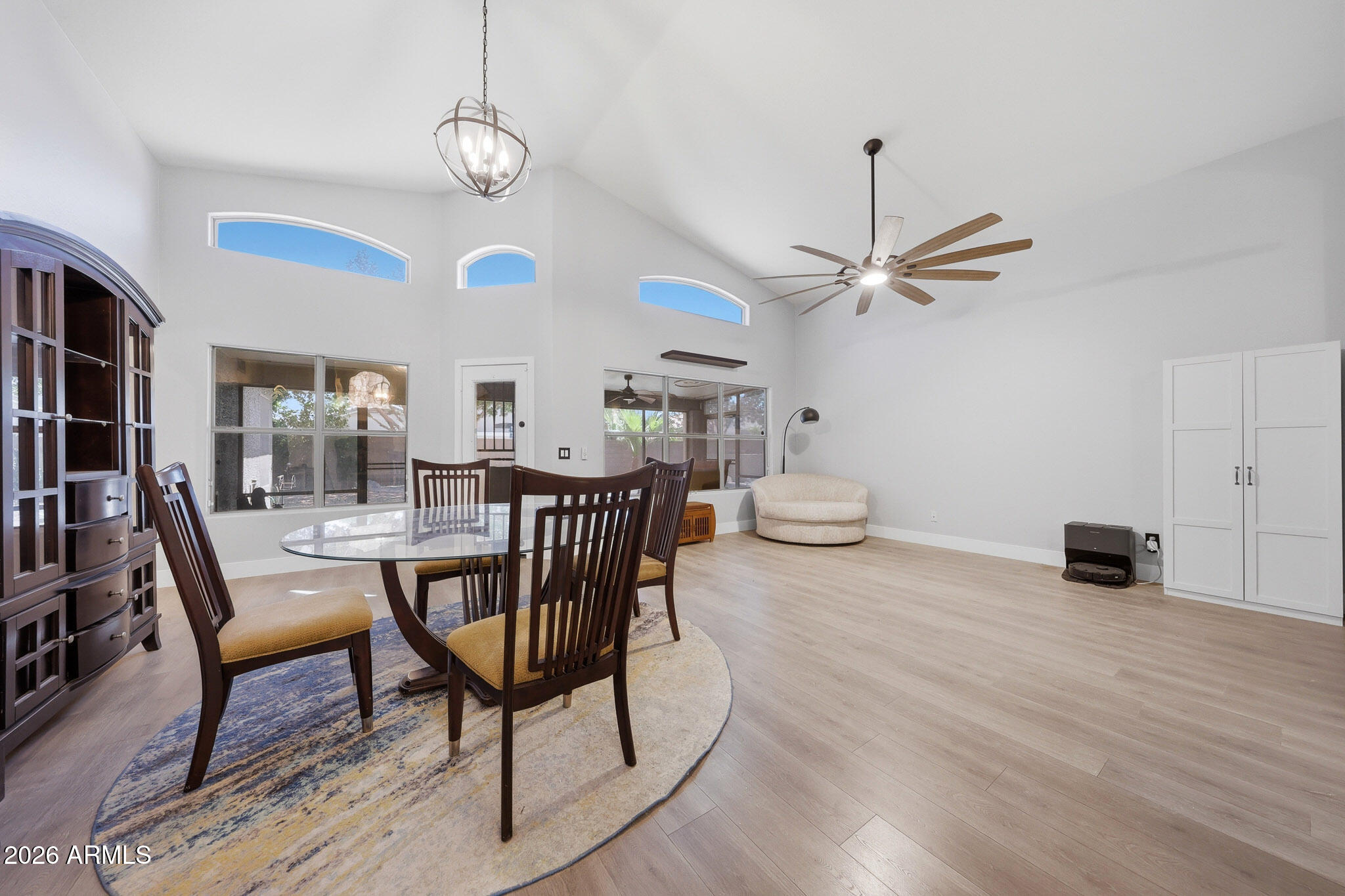 2153 East Kempton Road Chandler, AZ 85225 - Photo 4 of 50 a view of a dining room with furniture window and wooden floor