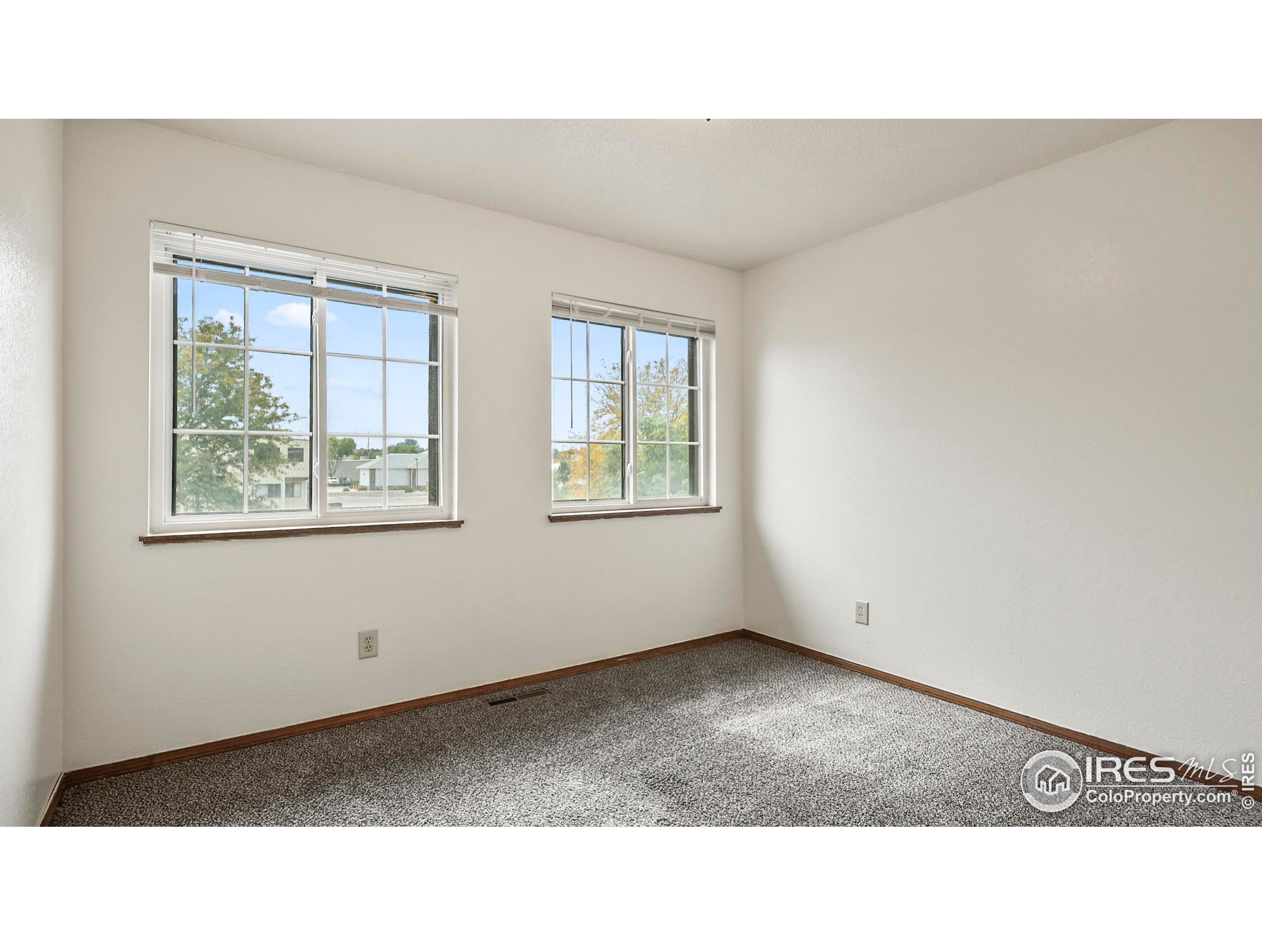 5809 West 18th Street Greeley, CO 80634 - Photo 11 of 25 a black and white photo of a living room