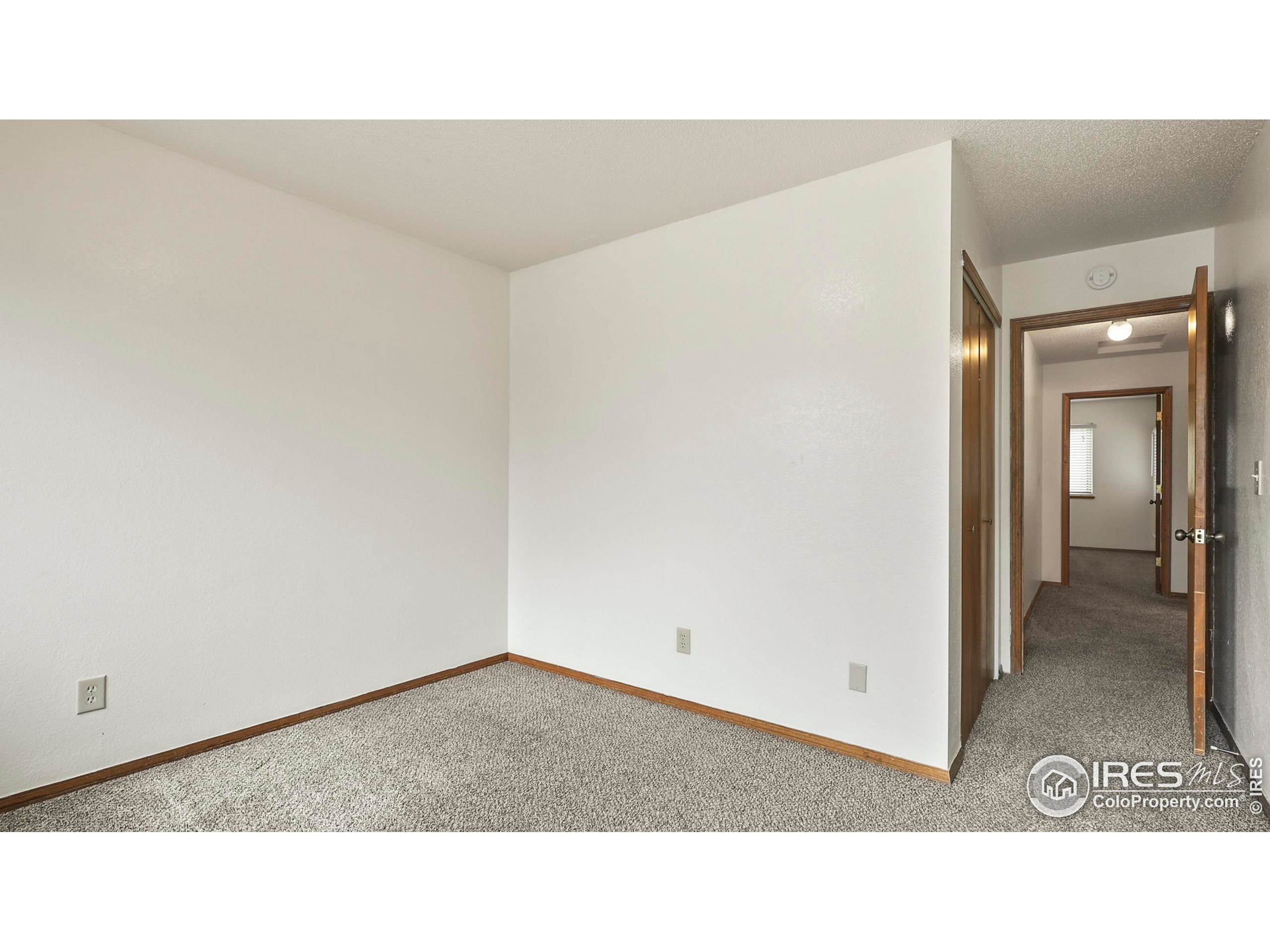 5809 West 18th Street Greeley, CO 80634 - Photo 12 of 25 a open space with a cabinet and mirror