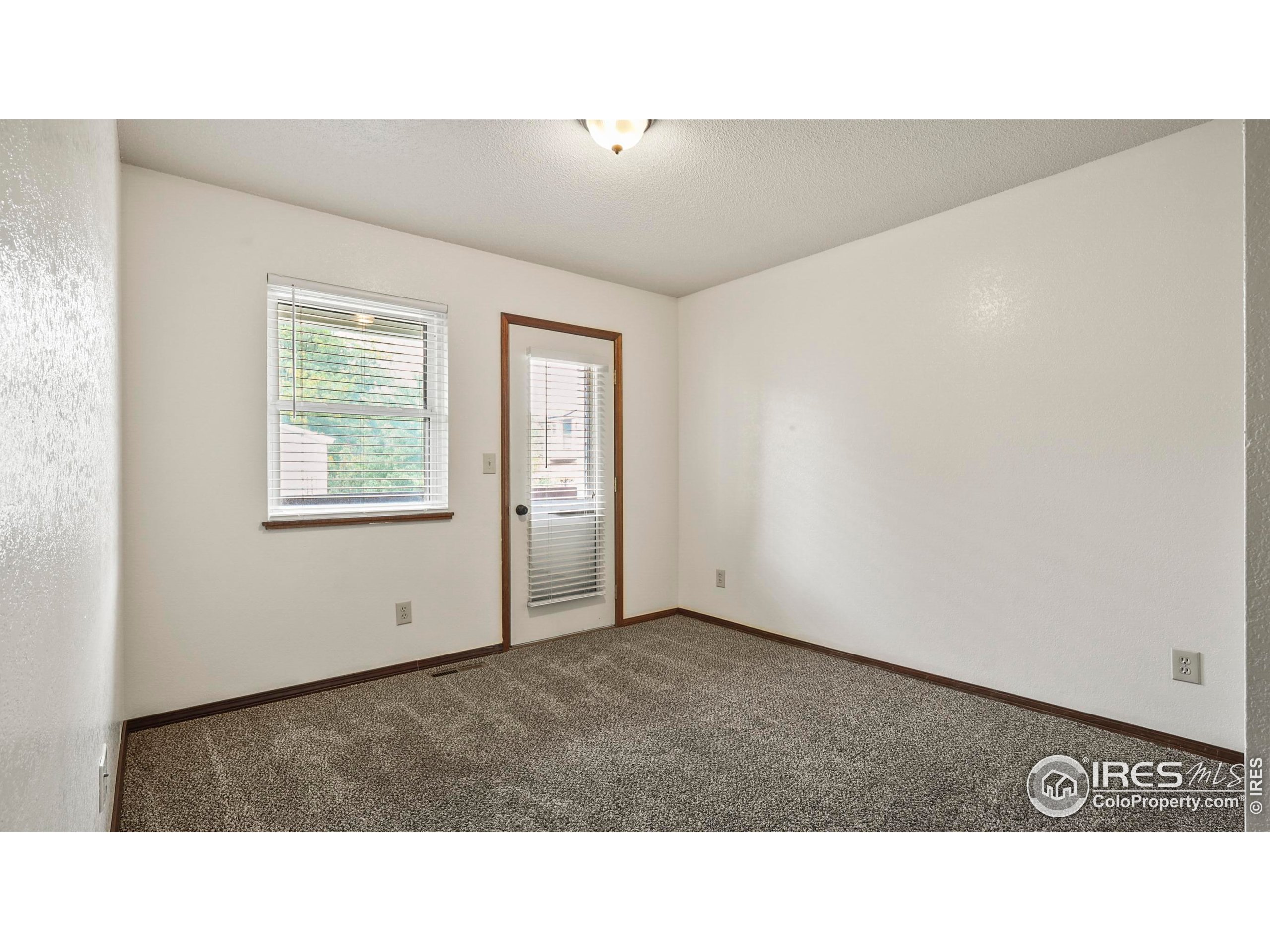 5809 West 18th Street Greeley, CO 80634 - Photo 14 of 25 a black and white photo of a living room