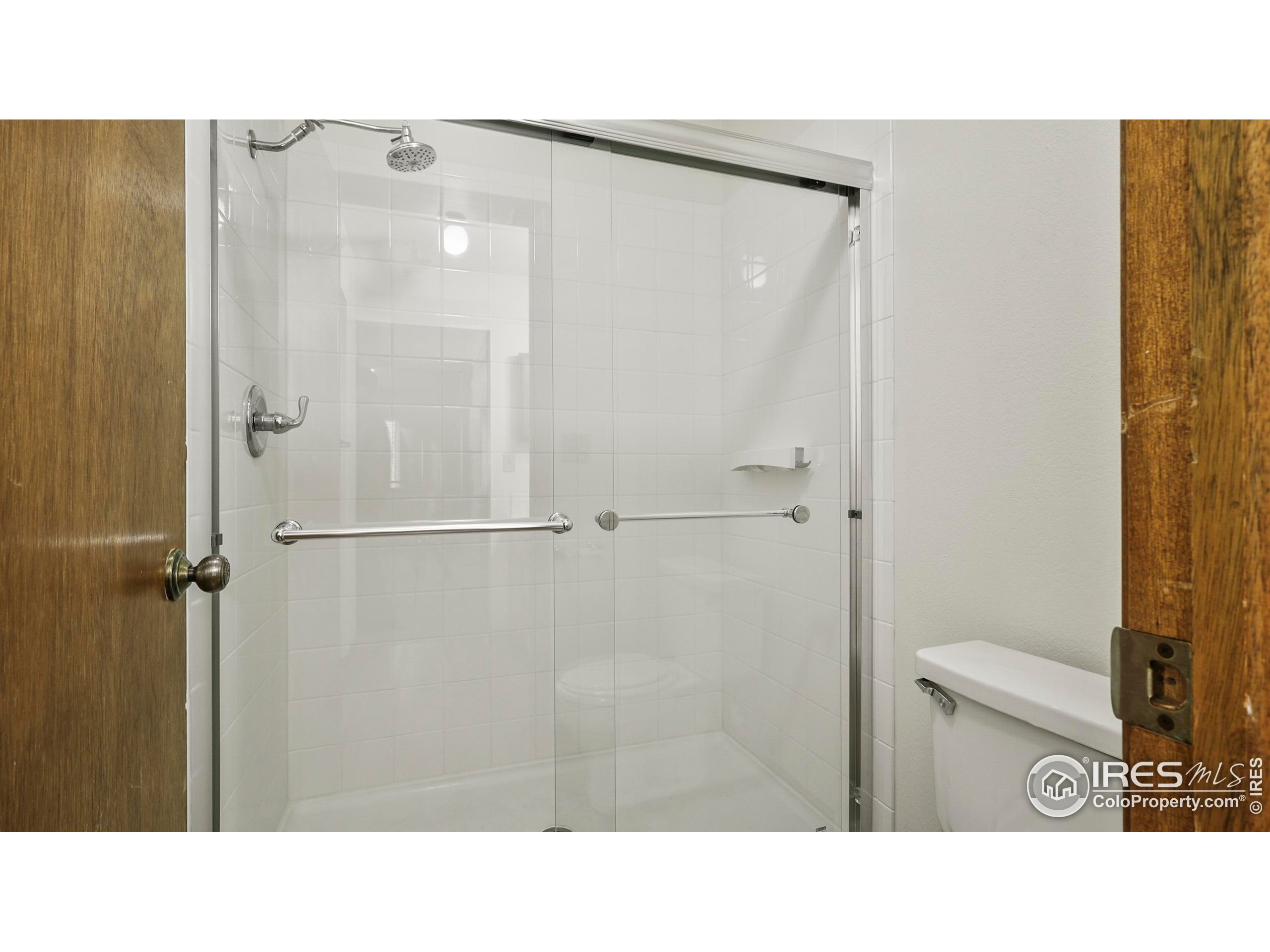 5809 West 18th Street Greeley, CO 80634 - Photo 19 of 25 a bathroom with a sink and a mirror