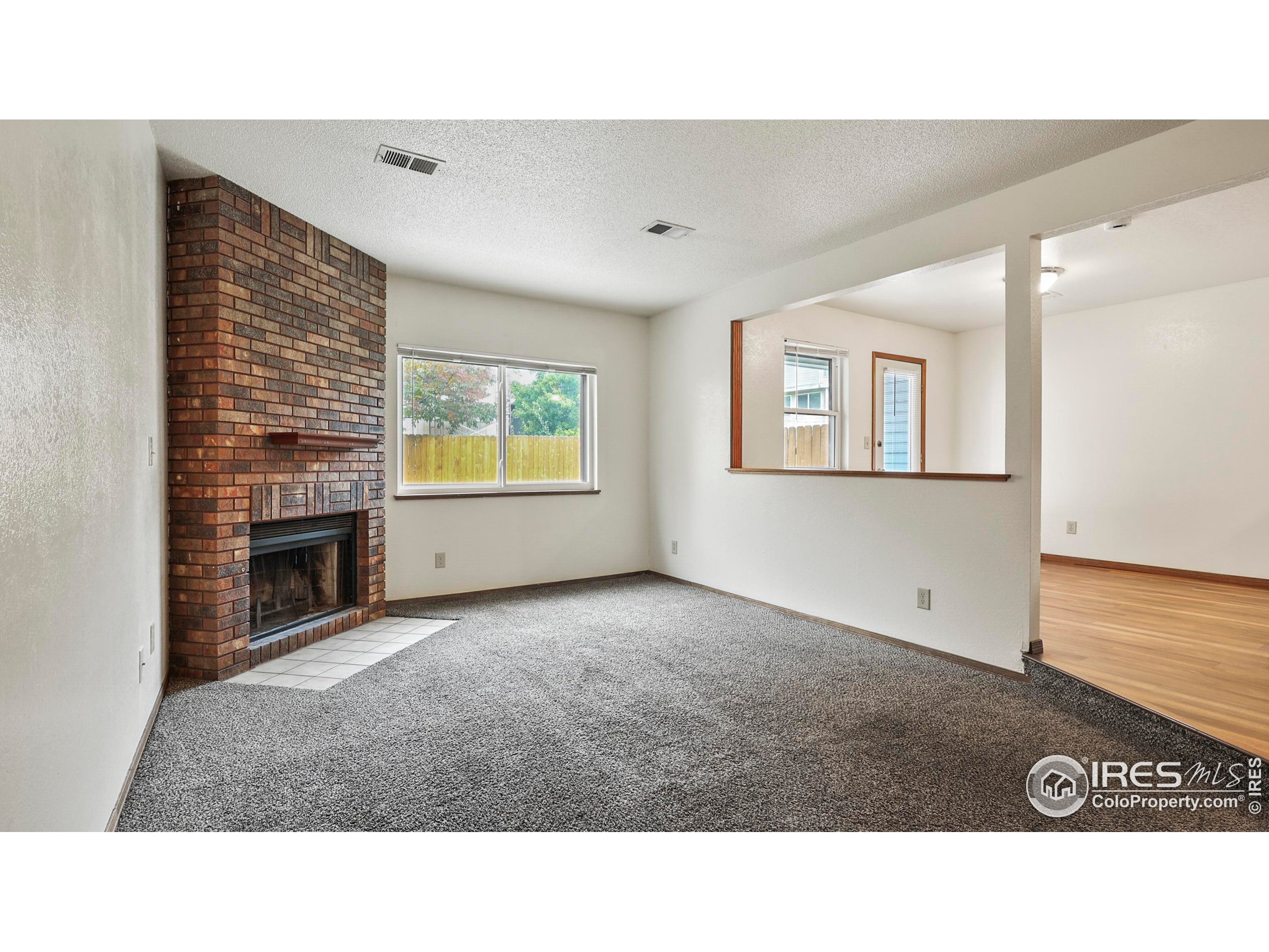 5809 West 18th Street Greeley, CO 80634 - Photo 2 of 25 a view interior of a house with a fireplace