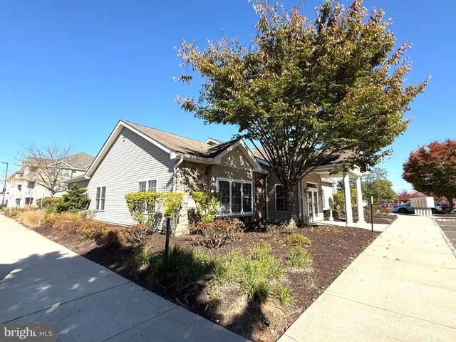 a living room with furniture a dining table and chairs