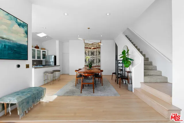 a bedroom with a bed window and chair