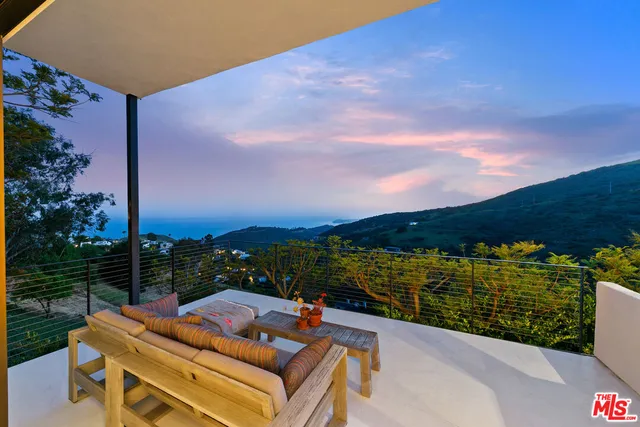 a view of a terrace with a lake view