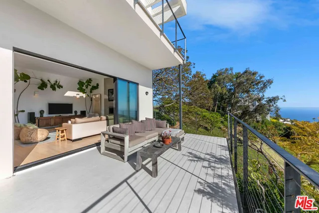 a view of balcony with furniture
