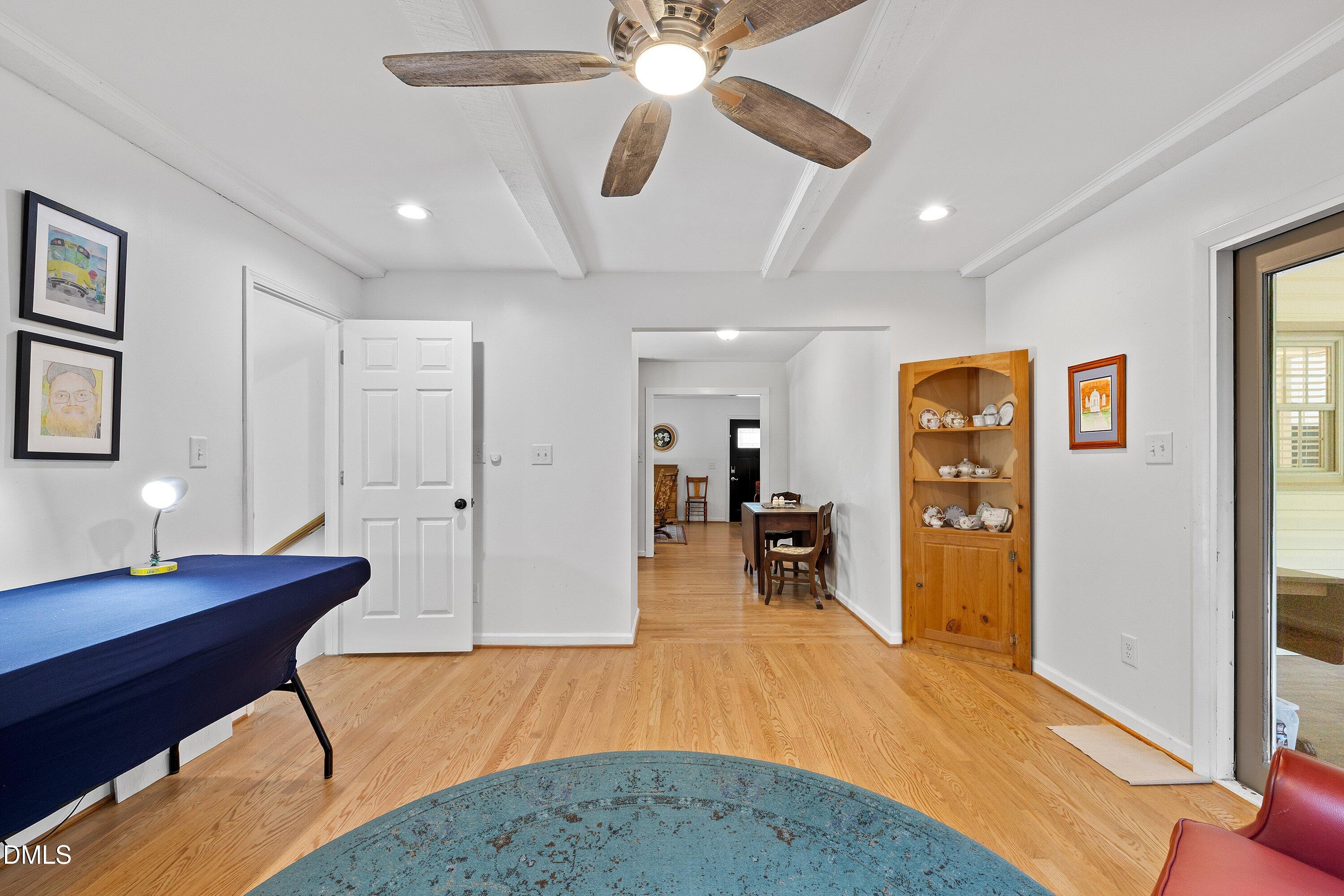 1445 Sedwick Road Durham, NC 27713 - Photo 17 of 48 a living room with furniture and a wooden floor