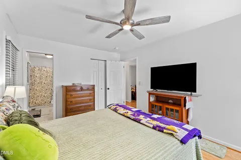 a bedroom with a bed and a closet