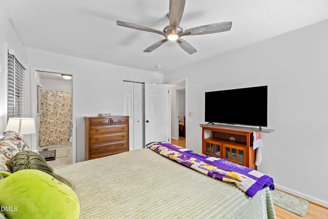 a bedroom with a bed and a closet