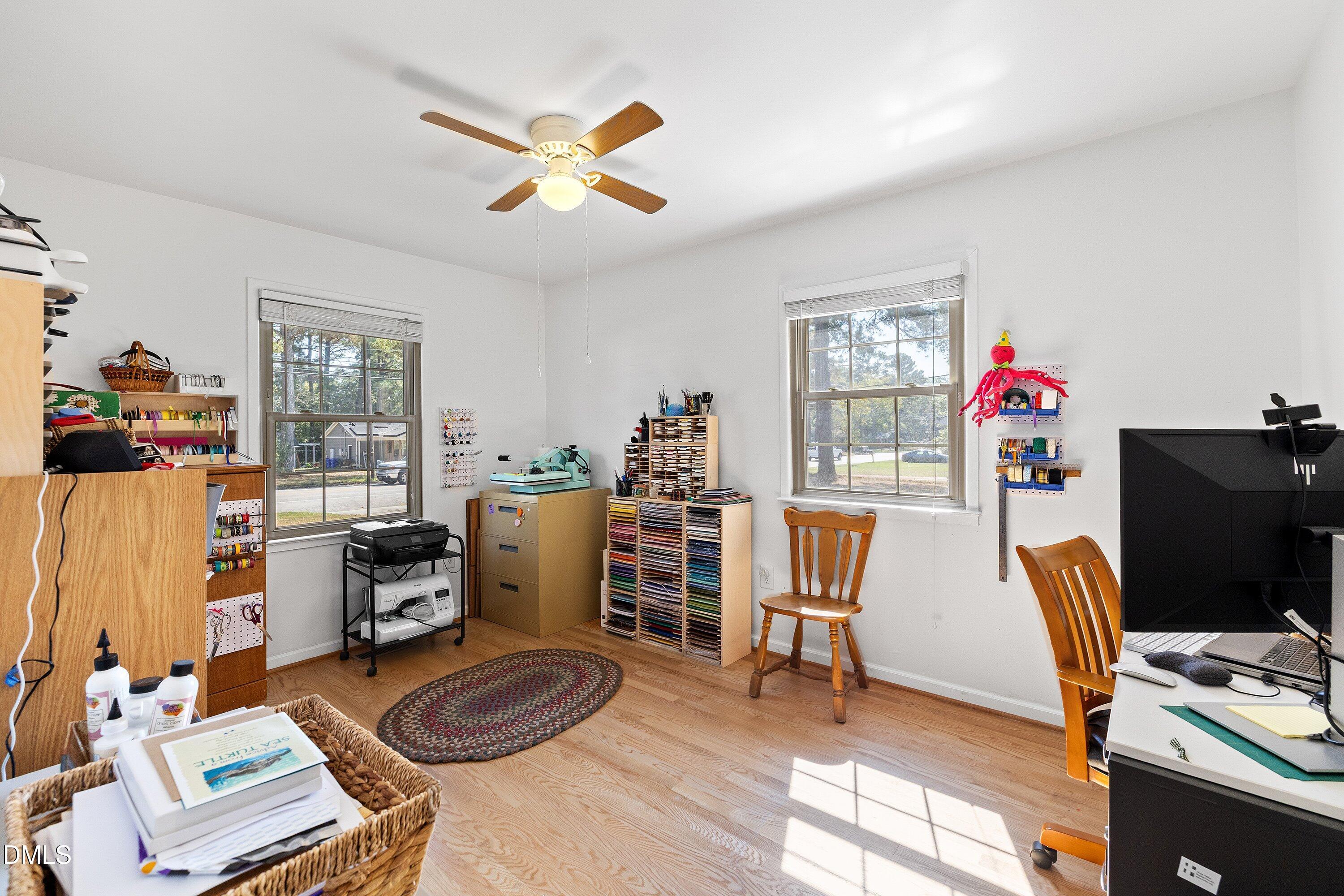 1445 Sedwick Road Durham, NC 27713 - Photo 25 of 48 a view of a workspace with furniture and a window