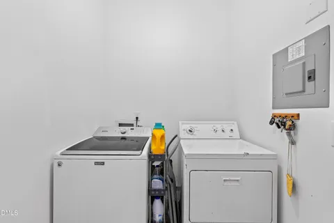 a bathroom with a sink mirror and toilet
