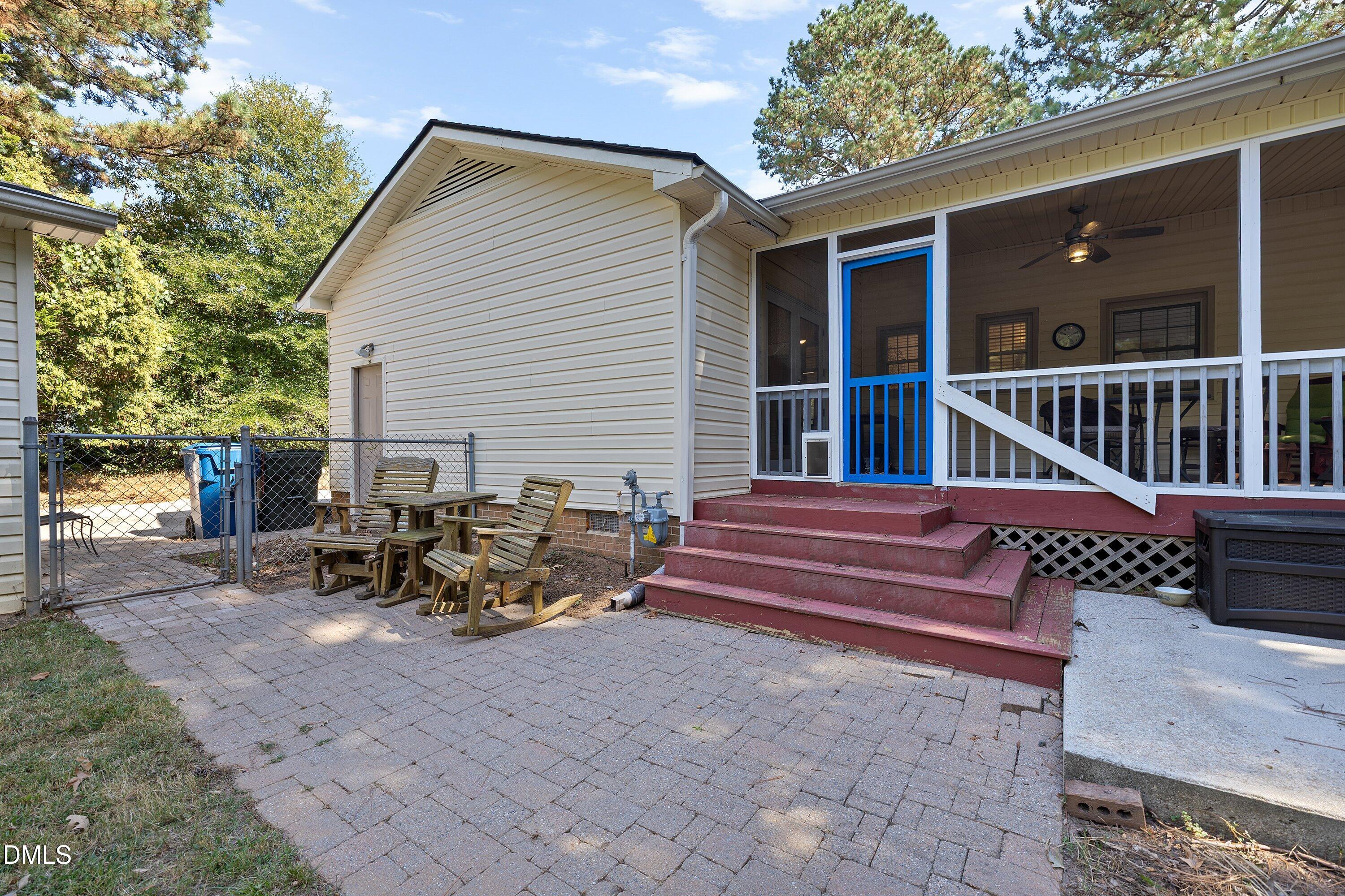 1445 Sedwick Road Durham, NC 27713 - Photo 31 of 48 a view of a deck with table and chairs with wooden floor and fence