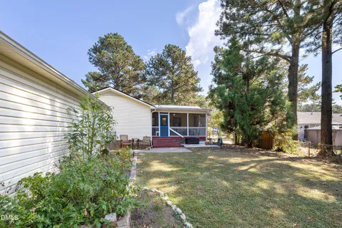 a view of a small yard in front of a house