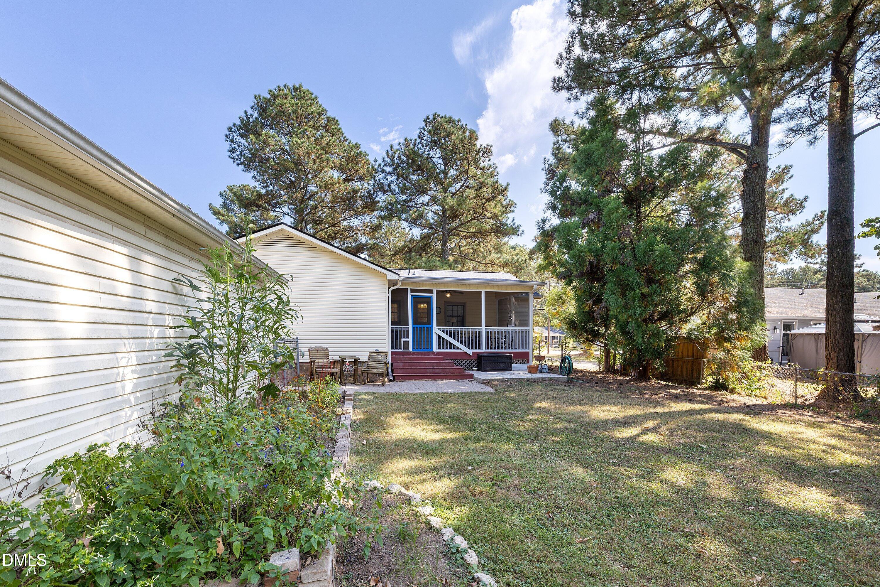 1445 Sedwick Road Durham, NC 27713 - Photo 35 of 48 a view of a house with backyard and sitting area