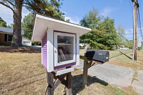 a house with trees in the background
