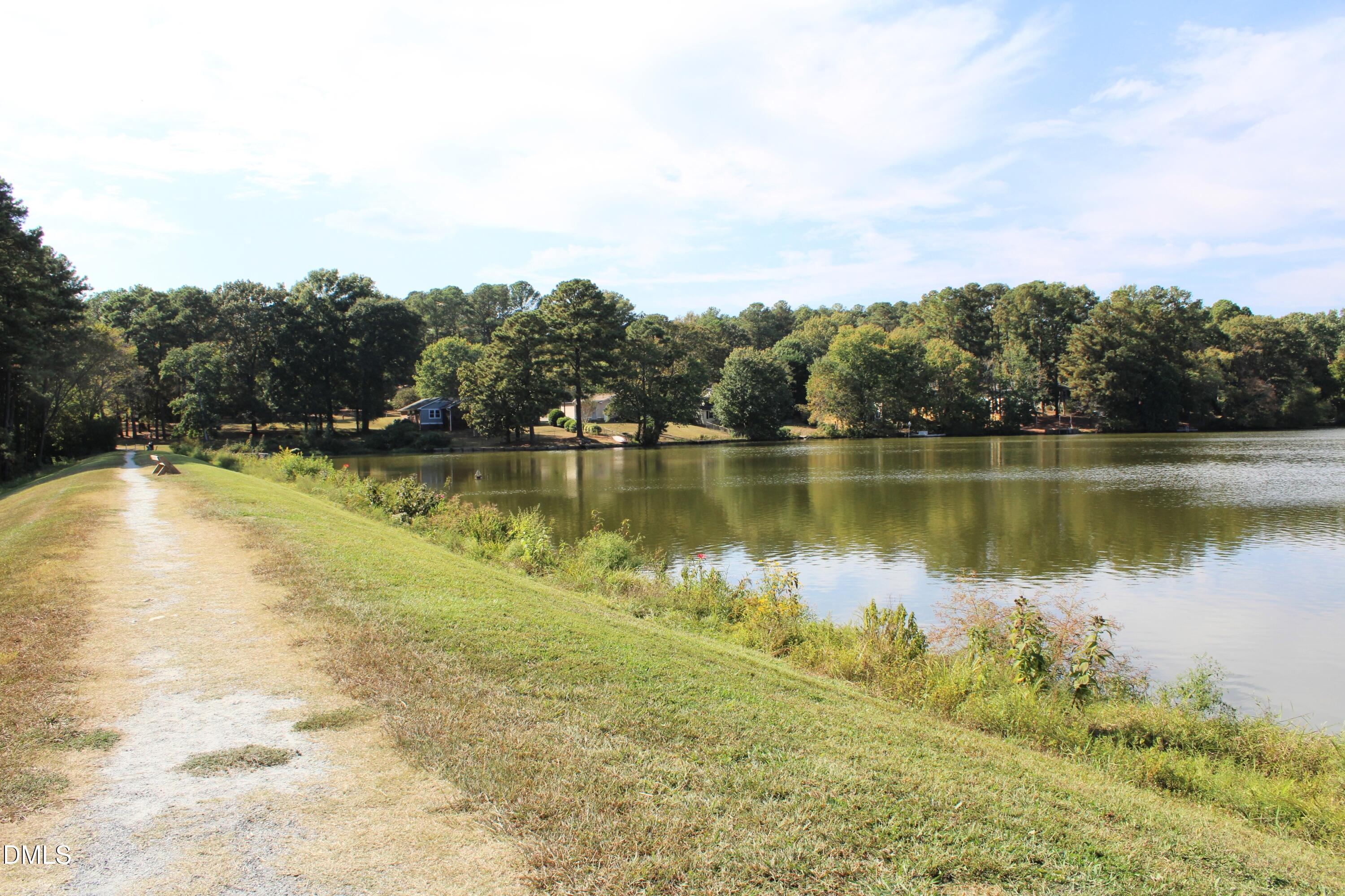 1445 Sedwick Road Durham, NC 27713 - Photo 44 of 48 a view of a lake with houses in the back