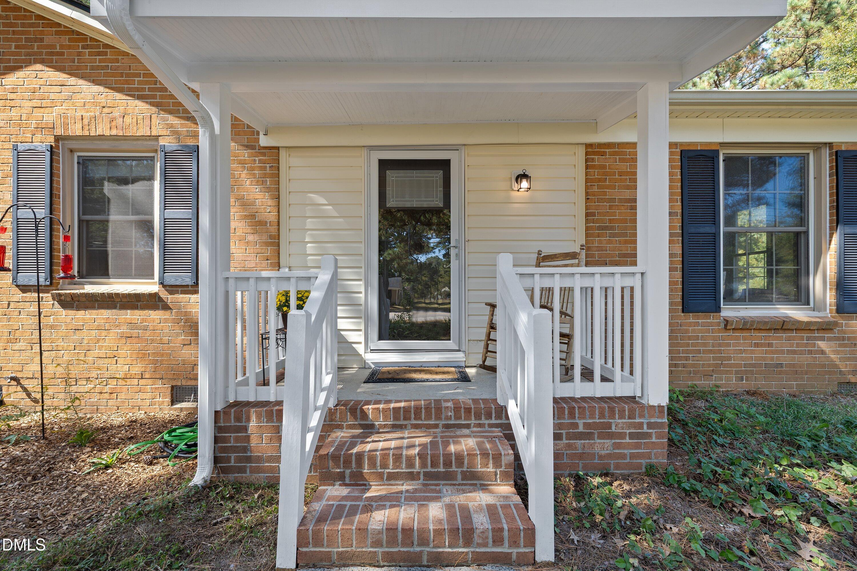 1445 Sedwick Road Durham, NC 27713 - Photo 4 of 48 front view of a house with a porch