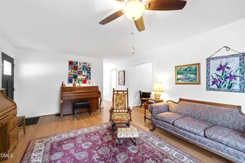 a living room with furniture rug and window