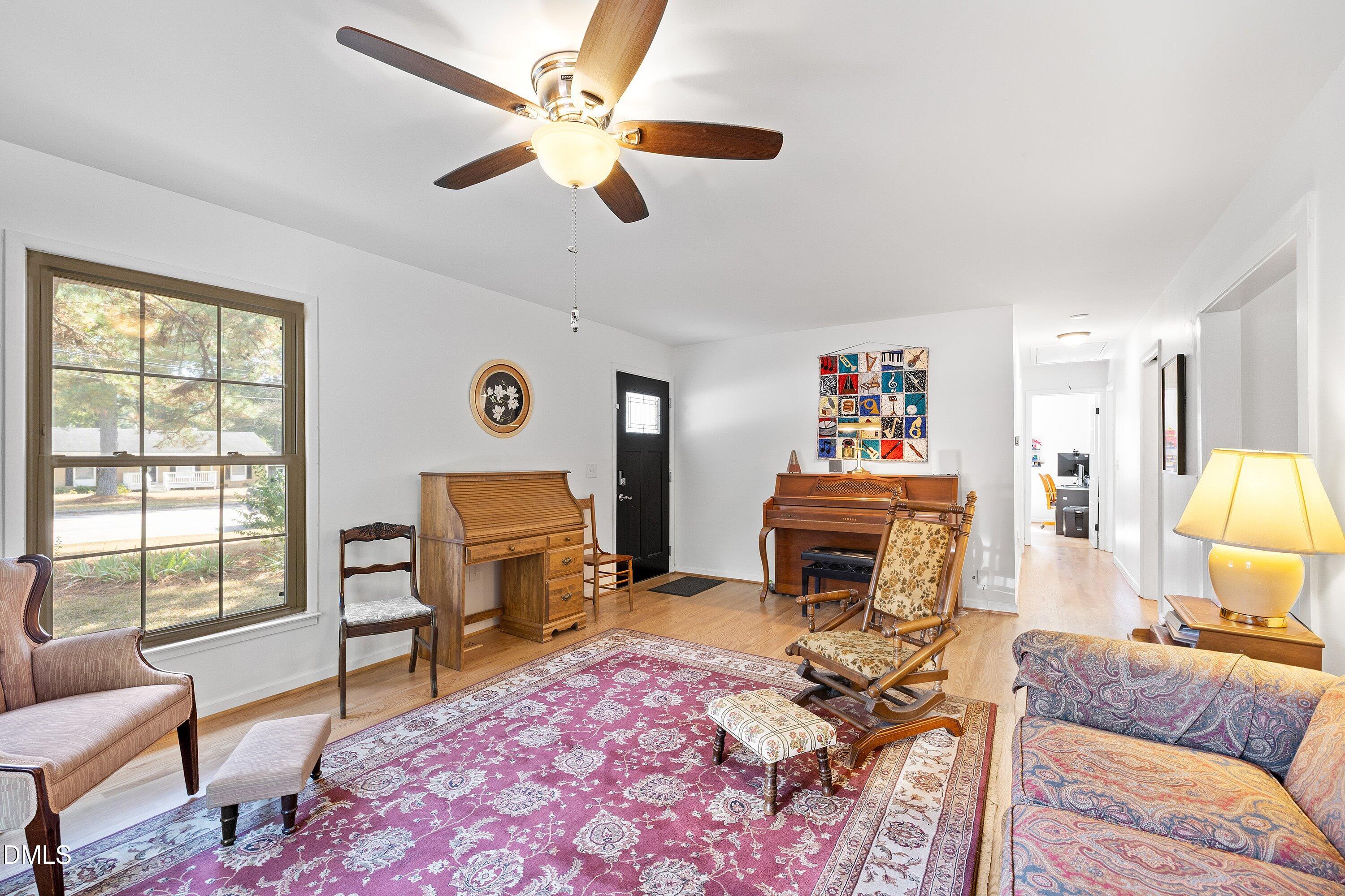 1445 Sedwick Road Durham, NC 27713 - Photo 7 of 48 a living room with furniture and a flat screen tv