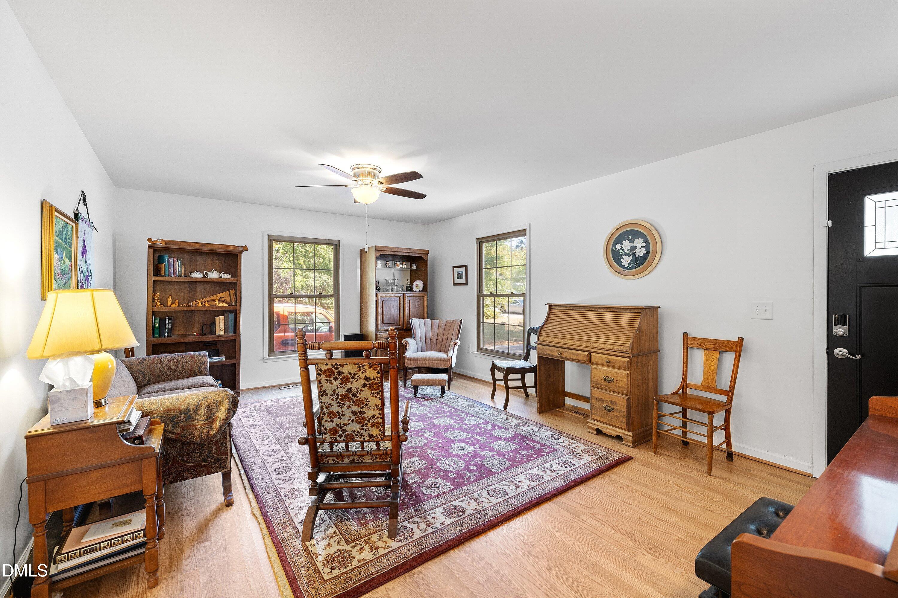 1445 Sedwick Road Durham, NC 27713 - Photo 8 of 48 a living room with furniture and a fireplace