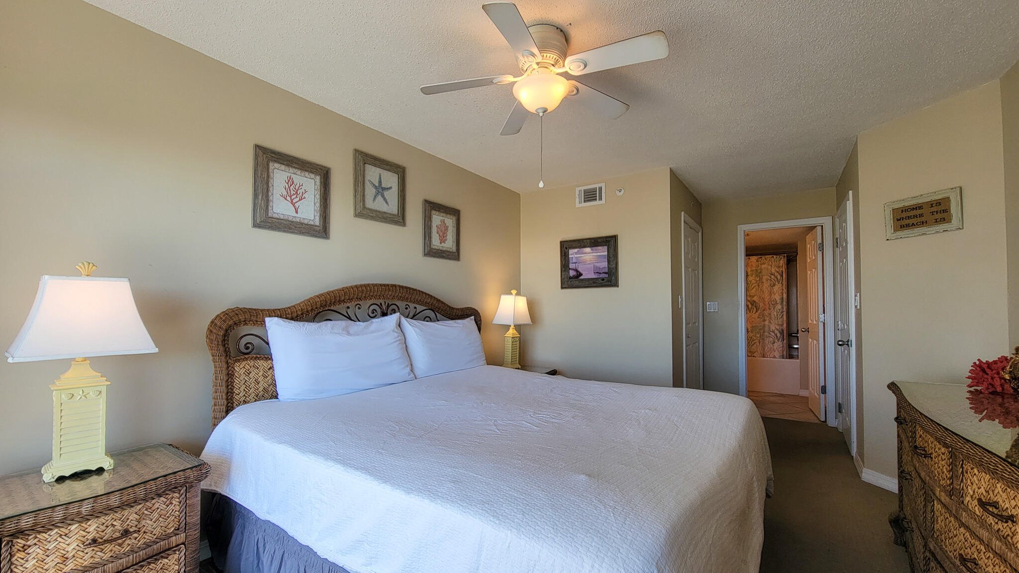 376 Santa Rosa Boulevard, Unit 115 Fort Walton Beach, FL 32548 - Photo 15 of 37 a bedroom with a bed and a chandelier