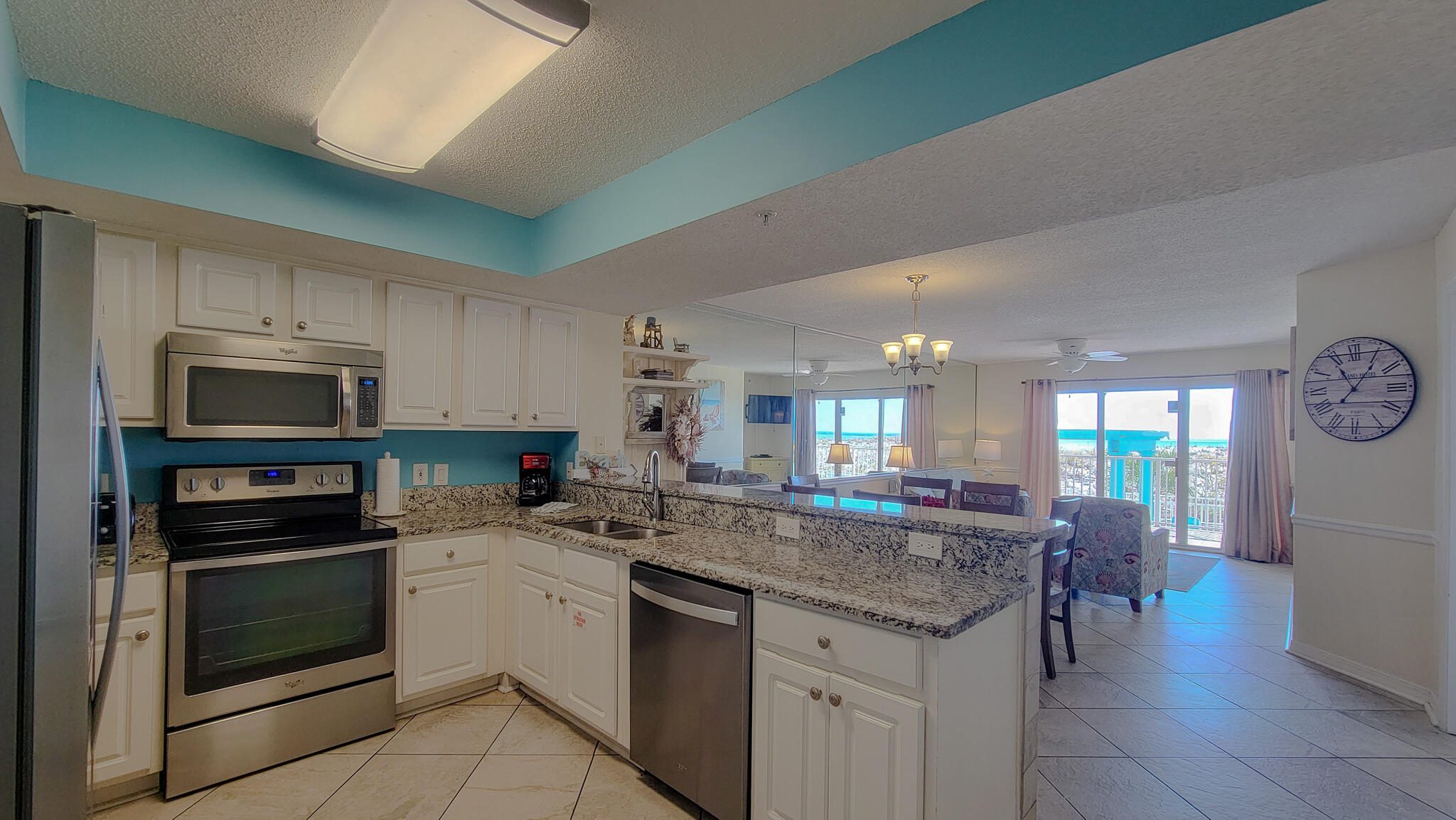 376 Santa Rosa Boulevard, Unit 115 Fort Walton Beach, FL 32548 - Photo 2 of 37 a kitchen with a sink stainless steel appliances and cabinets