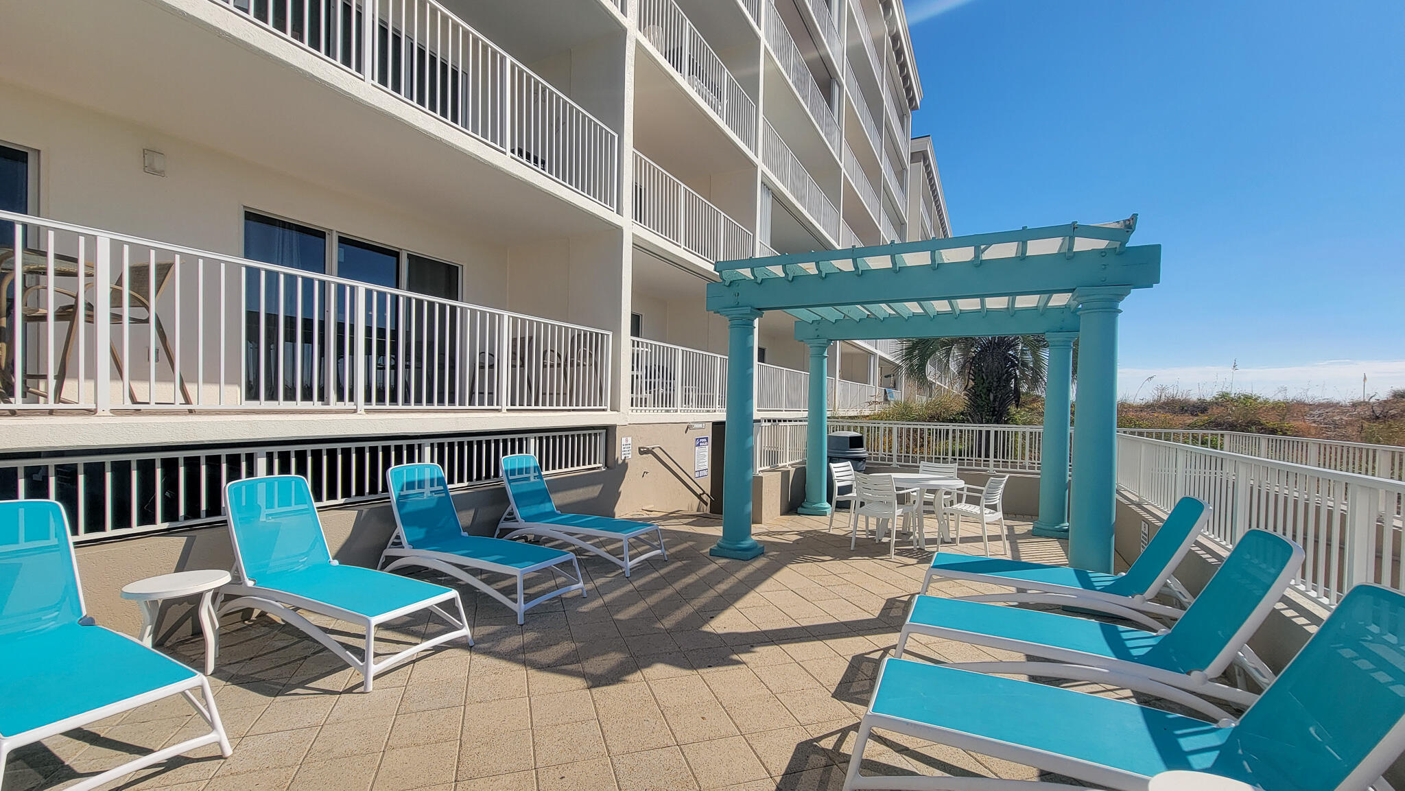 376 Santa Rosa Boulevard, Unit 115 Fort Walton Beach, FL 32548 - Photo 27 of 37 a view of a chairs and table in the balcony