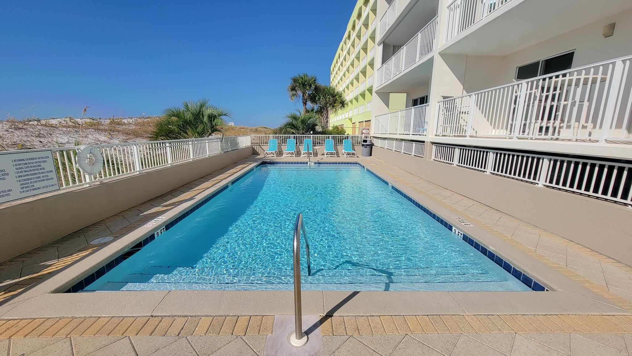 376 Santa Rosa Boulevard, Unit 115 Fort Walton Beach, FL 32548 - Photo 28 of 37 a view of a house with a balcony