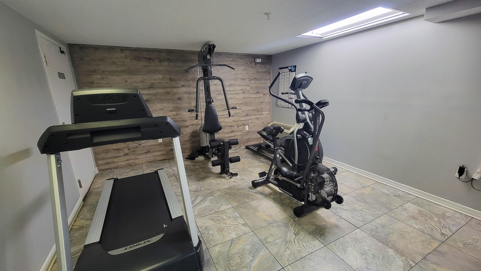 376 Santa Rosa Boulevard, Unit 115 Fort Walton Beach, FL 32548 - Photo 37 of 37 a view of a livingroom with furniture and gym equipment