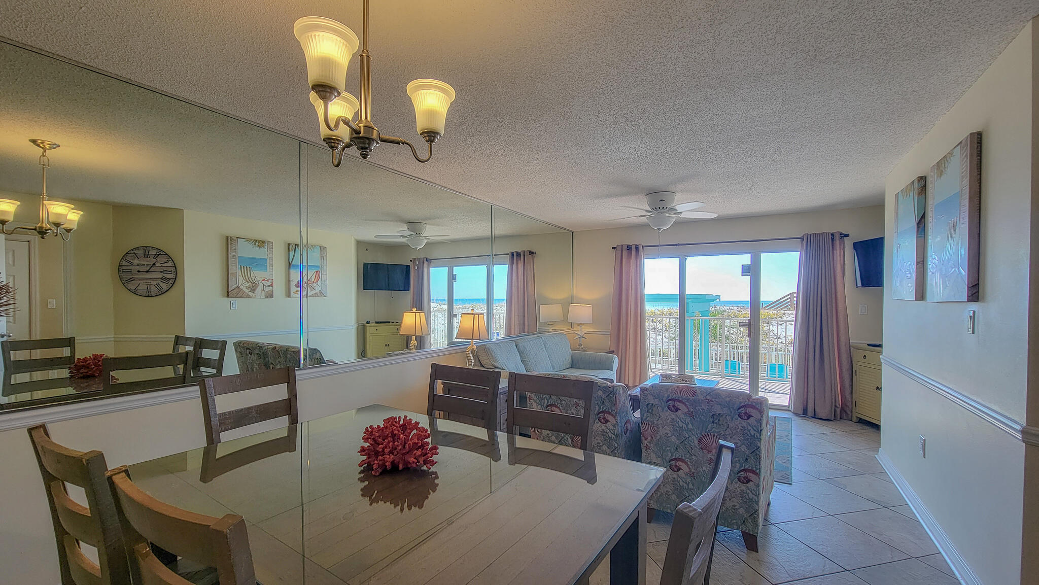 376 Santa Rosa Boulevard, Unit 115 Fort Walton Beach, FL 32548 - Photo 6 of 37 a living room with furniture chandelier and a large window