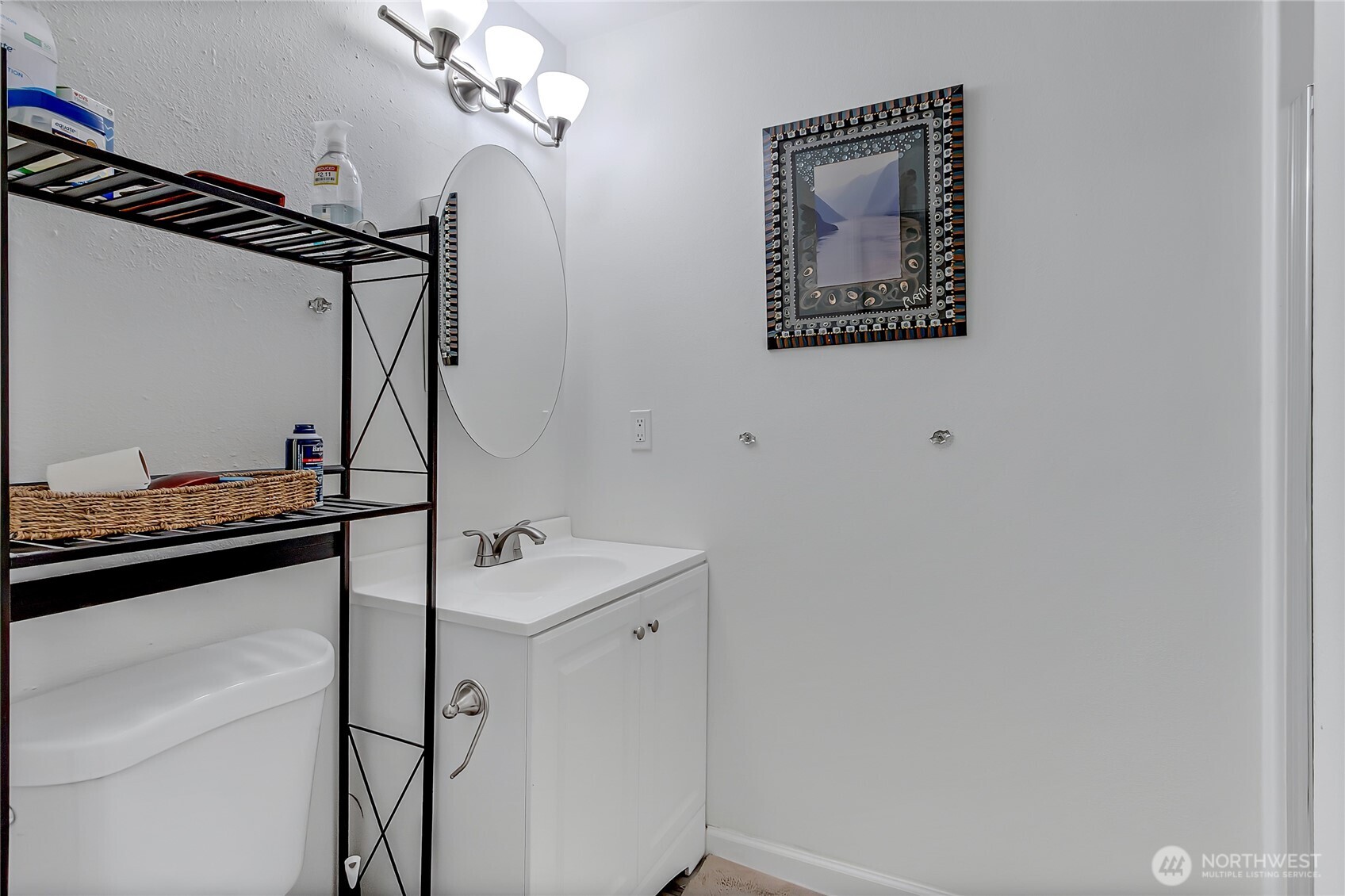 419 South 325th Place, Unit T7 Federal Way, WA 98003 - Photo 14 of 16 a bathroom with a sink and mirror