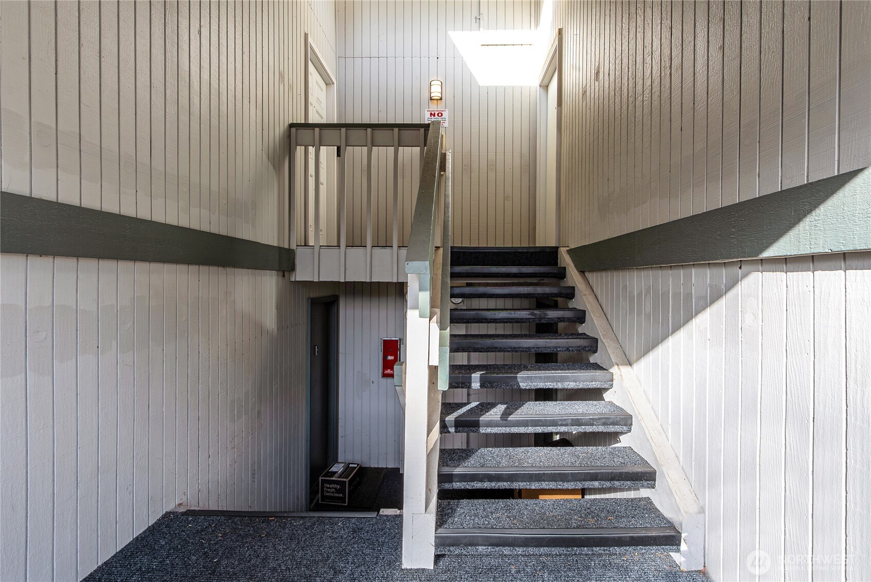 419 South 325th Place, Unit T7 Federal Way, WA 98003 - Photo 16 of 16 a view of entryway and hall with wooden floor