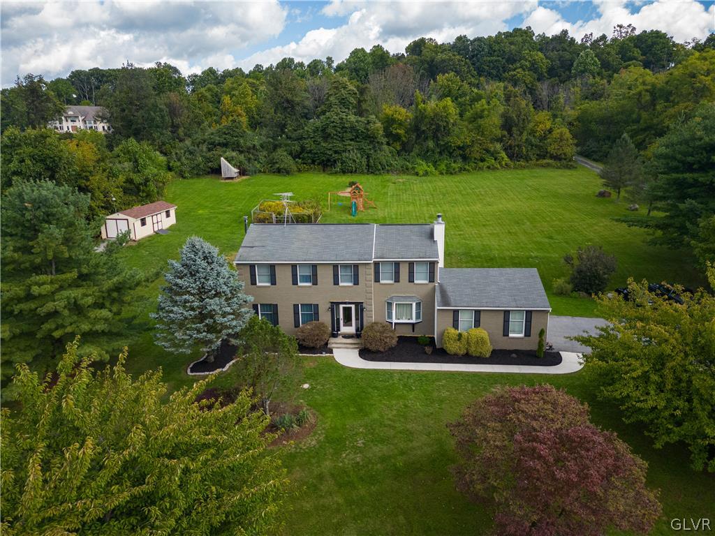 2753 Buttermilk Road Hellertown, PA 18055 - Photo 1 of 42 an aerial view of a house with swimming pool garden view and trees