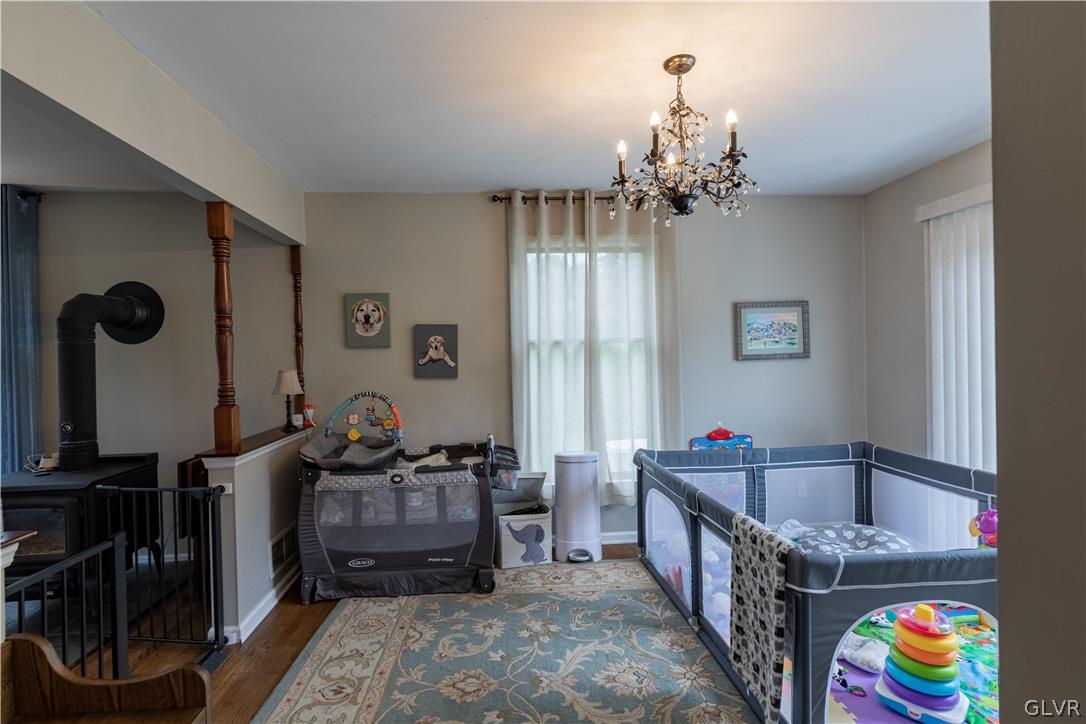 2753 Buttermilk Road Hellertown, PA 18055 - Photo 21 of 42 a bedroom with furniture and a chandelier