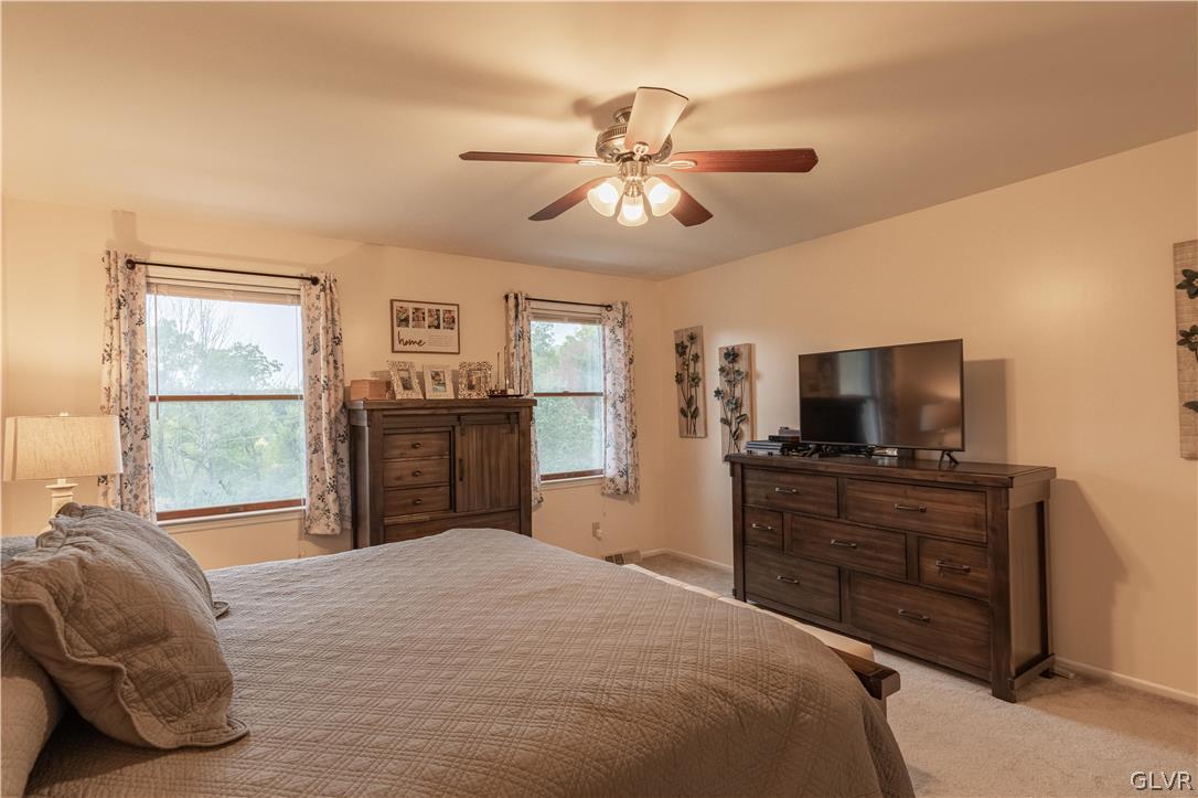 2753 Buttermilk Road Hellertown, PA 18055 - Photo 24 of 42 a bedroom with a bed and a flat screen tv