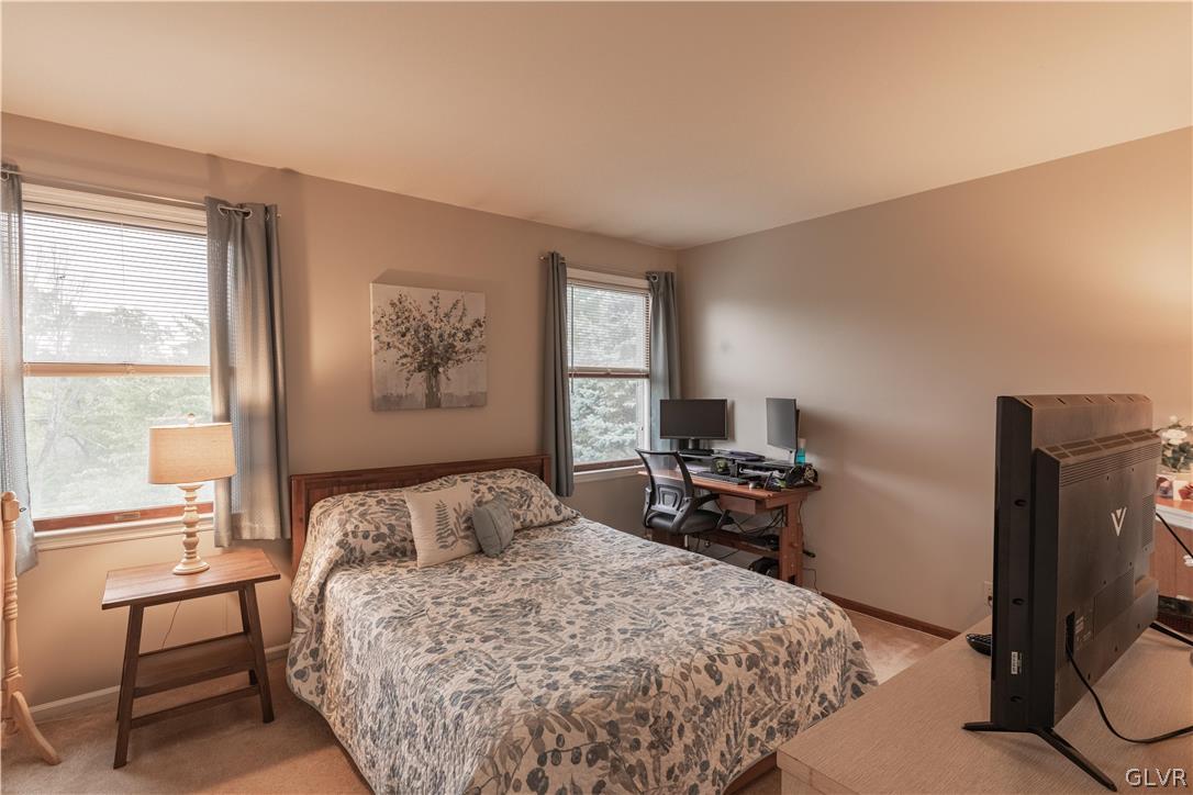 2753 Buttermilk Road Hellertown, PA 18055 - Photo 32 of 42 a bedroom with a bed and wooden floor