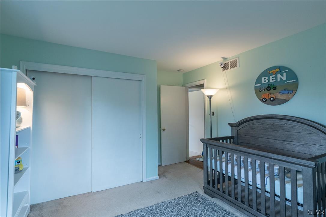 2753 Buttermilk Road Hellertown, PA 18055 - Photo 36 of 42 a bedroom with a bed and a painting on the wall