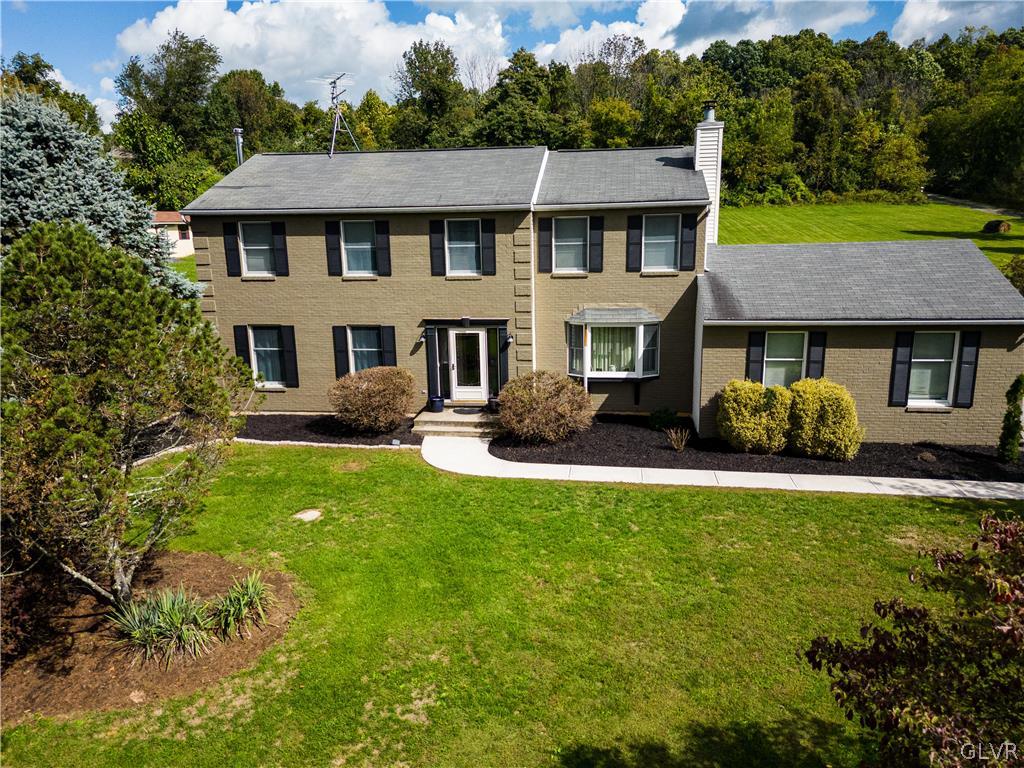 2753 Buttermilk Road Hellertown, PA 18055 - Photo 4 of 42 a front view of a house with garden