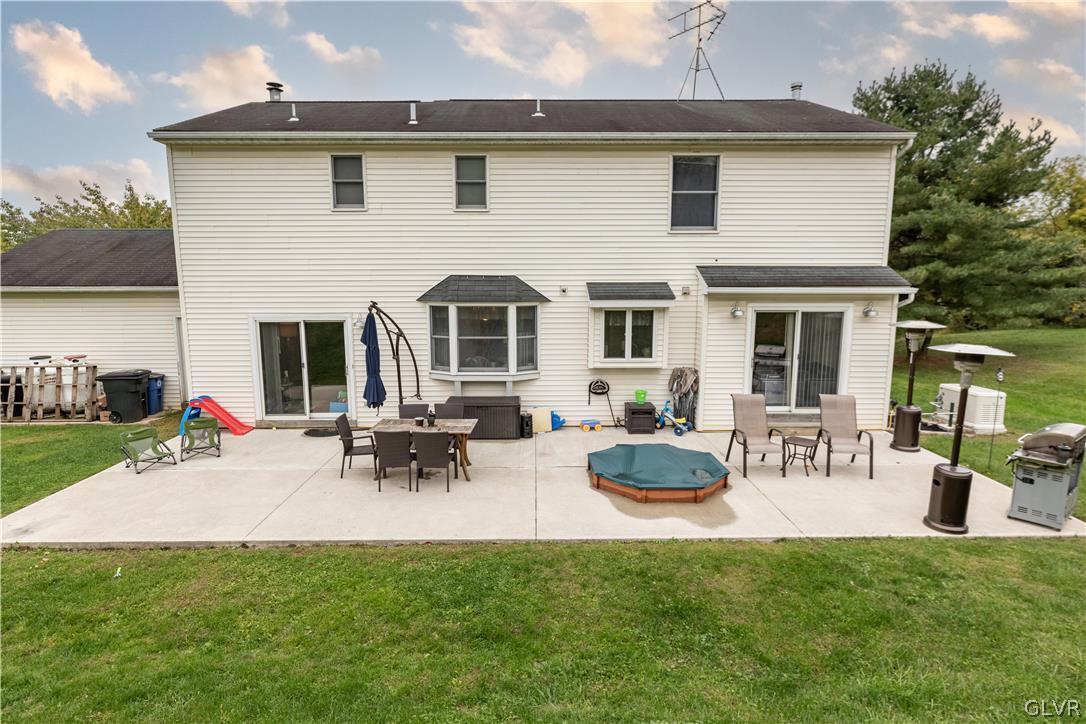 2753 Buttermilk Road Hellertown, PA 18055 - Photo 5 of 42 a view of a house with backyard sitting area and garden