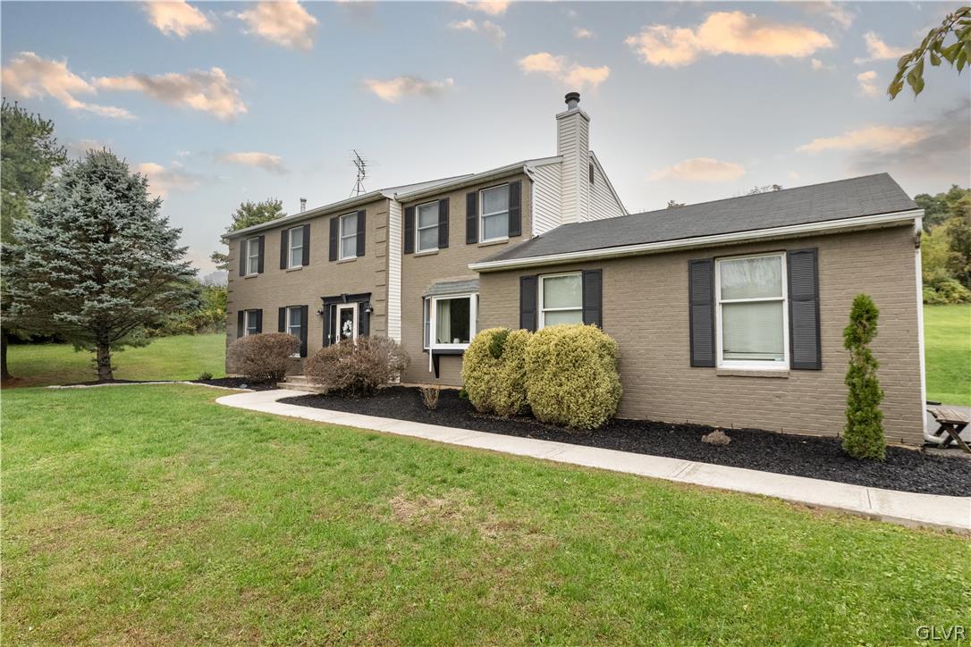 2753 Buttermilk Road Hellertown, PA 18055 - Photo 6 of 42 a house view with a garden space