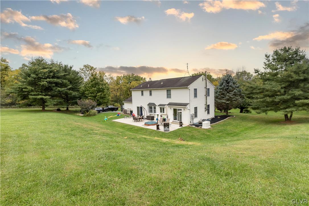 2753 Buttermilk Road Hellertown, PA 18055 - Photo 7 of 42 a view of a house with a big yard and large trees