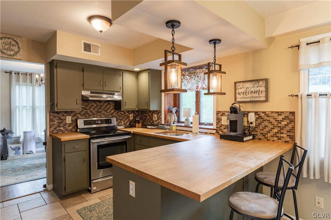2753 Buttermilk Road Hellertown, PA 18055 - Photo 9 of 42 a kitchen with sink cabinets and stainless steel appliances