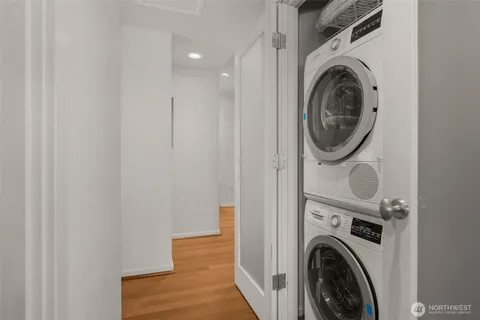 a view of a hallway with washer and dryer