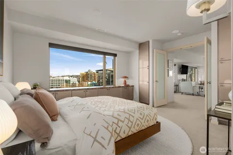 a bedroom with a large bed and a view of bedroom