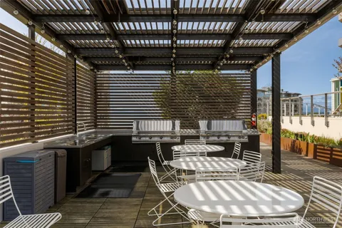 a patio with table and chairs