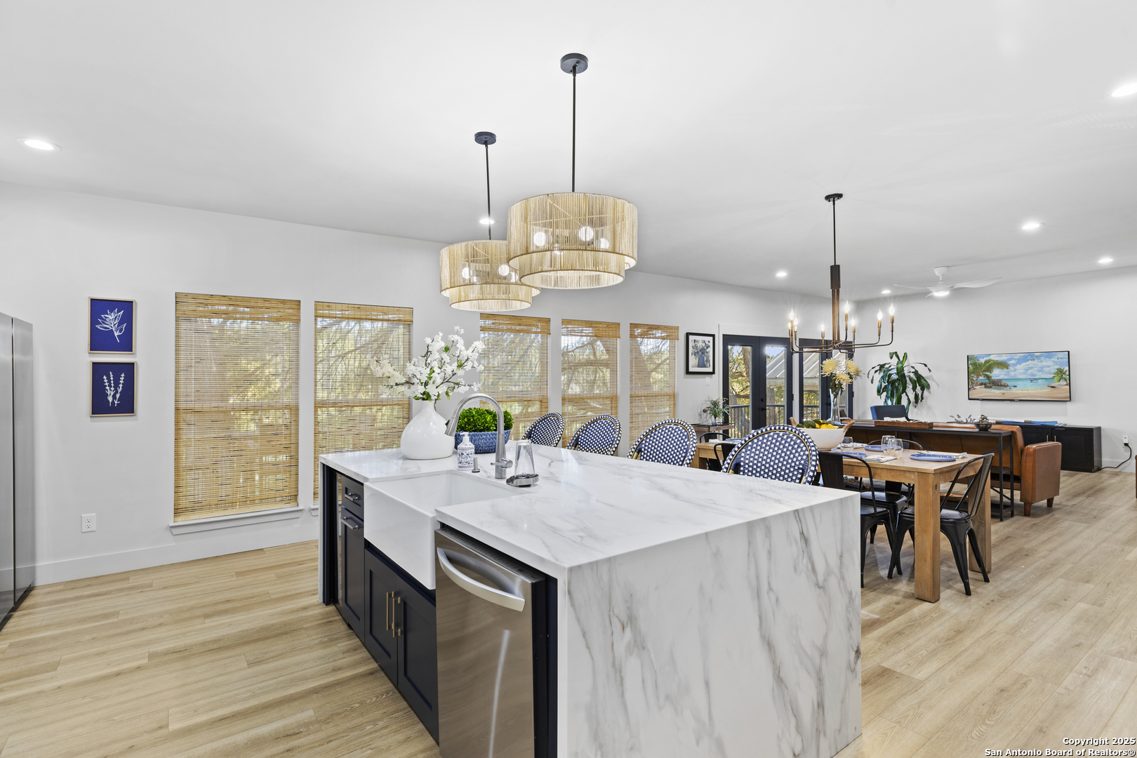 6789 River New Braunfels, TX 78132 - Photo 16 of 50 a view of a dining room and livingroom with furniture wooden floor a chandelier