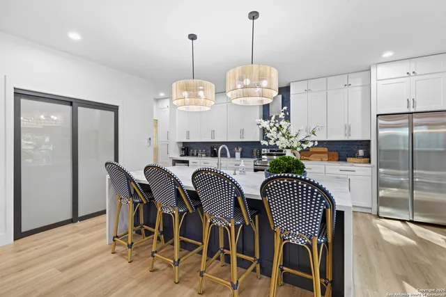 a view of kitchen and dining room with wooden floor