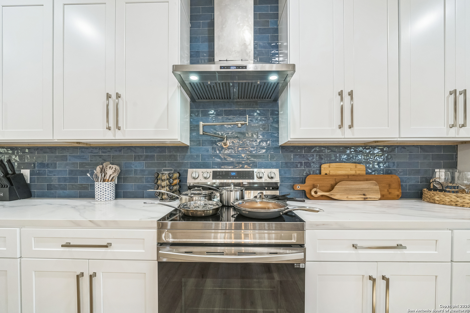 6789 River New Braunfels, TX 78132 - Photo 20 of 50 a kitchen with a stove and cabinets